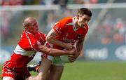 26 June 2005; Paul McGrane, Armagh, in action against Patsy Bradley, Derry. Bank of Ireland Ulster Senior Football Championship Semi-Final, Armagh v Derry, Casement Park, Belfast. Picture Credit; David Maher / SPORTSFILE