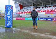 14 February 2014; Referee Leighton Hodges insects the pitch before calling the match off due to the Ravenhill pitch being water logged. Celtic League 2013/14, Round 14, Ulster v Scarlets, Ravenhill Park, Belfast, Co. Antrim. Picture credit: John Dickson / SPORTSFILE