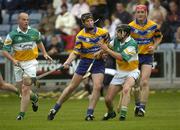 2 July 2005; Colm Forde, Clare, supported by team-mate Brian Lohan in action against Brendan Murphy and Stephen Brown, left, Offaly. Guinness All-Ireland Senior Hurling Championship Qualifier, Round 2, Offaly v Clare, O'Moore Park, Portlaoise, Co. Laois. Picture credit; Damien Eagers / SPORTSFILE
