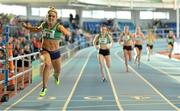 16 February 2014; Kelly Proper, Ferrybank AC, crosses the line to win the Women's 200m. Woodie’s DIY National Senior Indoor Track and Field Championships, Athlone Institute of Technology International Arena, Athlone, Co. Westmeath. Picture credit: Brendan Moran / SPORTSFILE