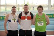 16 February 2014; Winner of the men's shot putt event Sean Breathnach, Galway City Harriers A.C., Co. Galway, centre, with second place Paul Collins, North Westmeath A.C., Co. Westmeath, right, and third place Kieron Stout, Celbridge A.C., Co. Kildare. Woodie’s DIY National Senior Indoor Track and Field Championships - Sunday. Athlone Institute of Technology International Arena, Athlone, Co. Westmeath. Picture credit: Stephen McCarthy / SPORTSFILE