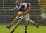 9 July 2005; Diarmuid Kinsella, Wexford, is tackled by Dick Clerkin, Monaghan. Bank of Ireland All-Ireland Senior Football Championship Qualifier, Round 2, Monaghan v Wexford, St. Tighernach's Park, Clones, Co. Monaghan. Picture credit; Pat Murphy / SPORTSFILE