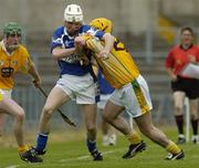9 July 2005; Tommy Fitzgerald, Laois, is tackled by Conor Cunning, Antrim. Guinness All-Ireland Senior Hurling Championship Qualifier, Round 3, Antrim v Laois, Casement Park, Belfast. Picture credit; Matt Browne / SPORTSFILE