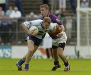 9 July 2005; Eoin Lennon, Monaghan, is tackled by Matty Forde, Wexford. Bank of Ireland All-Ireland Senior Football Championship Qualifier, Round 2, Monaghan v Wexford, St. Tighernach's Park, Clones, Co. Monaghan. Picture credit; Pat Murphy / SPORTSFILE