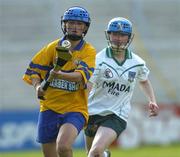 9 July 2005; Laura Linnane, Clare, in action against Mairead Kelly, Limerick. Munster Junior Camogie Championship Final, Limerick v Clare, Gaelic Grounds, Limerick. Picture credit; Damien Eagers / SPORTSFILE