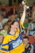 9 July 2005; Deirdre Murphy, Clare, lifts the cup. Munster Junior Camogie Championship Final, Limerick v Clare, Gaelic Grounds, Limerick. Picture credit; Damien Eagers / SPORTSFILE