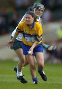 9 July 2005; Catherine O'Loughlin, Clare, in action against Sarah Collins, Limerick. Munster Junior Camogie Championship Final, Limerick v Clare, Gaelic Grounds, Limerick. Picture credit; Damien Eagers / SPORTSFILE