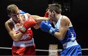 21 February 2014; Joe Fitzpatrick, left, Immaculata boxing club, exchanges punches with James McDowell, Univerisity boxing club Limerick, during their 60kg bout. National Senior Boxing Championships, First Round, National Stadium, Dublin. Picture credit: David Maher / SPORTSFILE