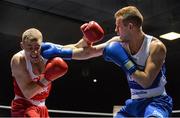 21 February 2014; Martin Noonan, left, Riverstown boxing club, exchanges punches with Sean Montgomery, Canal boxing club, during their 64kg bout. National Senior Boxing Championships, First Round, National Stadium, Dublin. Picture credit: David Maher / SPORTSFILE