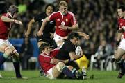 9 July 2005; Byron Kelleher, New Zealand, is tackled by Donnacha O'Callaghan, British and Irish Lions. British and Irish Lions Tour to New Zealand 2005, 3rd Test, New Zealand v British and Irish Lions, Eden Park, Auckland, New Zealand. Picture credit; Brendan Moran / SPORTSFILE