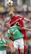 14 July 2005; John O'Flynn, Cork City, in action against Gediminas Paulauskas, FK Ekranas. UEFA Cup, First Qualifying Round, First Leg, FK Ekranas v Cork City, Aukstaitija, Panevezys, Lithuania. Picture credit; Brian Lawless / SPORTSFILE