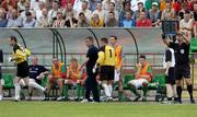 14 July 2005; Cork goalkeeper Michael Devine (1) leaves the field for substitute goalkeeper Phil Harrington after picking up an early injury as manager Damien Richardson looks on. UEFA Cup, First Qualifying Round, First Leg, FK Ekranas v Cork City, Aukstaitija, Panevezys, Lithuania. Picture credit; Brian Lawless / SPORTSFILE