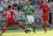 14 July 2005; John O'Flynn, Cork City, in action against Alfredas Skroblas, left, and Valerijus Mizigurskis, FK Ekranas. UEFA Cup, First Qualifying Round, First Leg, FK Ekranas v Cork City, Aukstaitija, Panevezys, Lithuania. Picture credit; Brian Lawless / SPORTSFILE