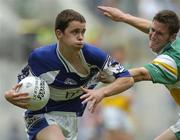 17 July 2005; Ciaran Delaney, Laois, is tackled by David Larkin, Offaly. Leinster Minor Football Championship Final, Offaly v Laois, Croke Park, Dublin. Picture credit; Brian Lawless / SPORTSFILE