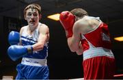 22 February 2014; Keith Flavin, left, Paulstown Boxing Club, exchanges punches with Danny Coughlan, St.Annes Boxing Club, during their 60kg bout. National Senior Boxing Championships, First Round, National Stadium, Dublin. Picture credit: Barry Cregg / SPORTSFILE