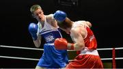 22 February 2014; George Bates, left, St.Mary's Boxing Club, exchanges punches with Kevin Fennessy, Clonmel Boxing Club, during their 60kg bout. National Senior Boxing Championships, First Round, National Stadium, Dublin. Picture credit: Barry Cregg / SPORTSFILE