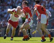 10 July 2005; Armagh's  Enda McNulty, supported by Andy Mallon, 2, tackles Peter Canavan, Tyrone. Bank of Ireland Ulster Senior Football Championship Final, Armagh v Tyrone, Croke Park, Dublin. Picture credit; Ray McManus / SPORTSFILE