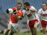 23 July 2005; Steve McDonnell, Armagh, is tackled by Shane Sweeney, Tyrone. Bank of Ireland Ulster Senior Football Championship Final Replay, Tyrone v Armagh, Croke Park, Dublin. Picture credit; Matt Browne / SPORTSFILE