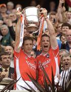 23 July 2005; Armagh captain Kieran McGeeney, left, and team-mate Paul McGrane lift the Angle Celt cup after the game. Bank of Ireland Ulster Senior Football Championship Final Replay, Tyrone v Armagh, Croke Park, Dublin. Picture credit; Brendan Moran / SPORTSFILE