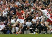 23 July 2005; Oisin McConville, Armagh, shoots to score the last point of the game under pressure from Brian Dooher, Tyrone. Bank of Ireland Ulster Senior Football Championship Final Replay, Tyrone v Armagh, Croke Park, Dublin. Picture credit; Matt Browne / SPORTSFILE