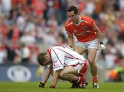 23 July 2005; Aaron Kernan, Armagh, taunts Tyrone's Philip Jordan after scoring a point late in the game. Bank of Ireland Ulster Senior Football Championship Final Replay, Tyrone v Armagh, Croke Park, Dublin. Picture credit; Brendan Moran / SPORTSFILE