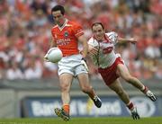 23 July 2005; Aaron Kernan, Armagh, in action against Brian Dooher, Tyrone. Bank of Ireland Ulster Senior Football Championship Final Replay, Tyrone v Armagh, Croke Park, Dublin. Picture credit; Brendan Moran / SPORTSFILE