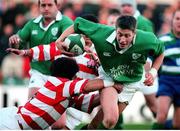 11 November 2000; Ronan O'Gara, Ireland, is tackled by Michinori Oda, Japan. International Rugby Friendly, Ireland v Japan, Lansdowne Road, Dublin. Picture credit: Ray Lohan / SPORTSFILE