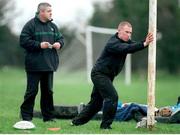 11 December 2000; Ireland scrum-half Peter Stringer, right, does some stretching exercises under the watchful eye of coach Warren Gatland during training. Ireland Rugby Squad Training, ALSAA training grounds, Co. Dublin. Picture credit: Brendan Moran / SPORTSFILE