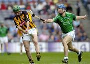 31 July 2005; Richard Mullally, Kilkenny, is tackled by James O'Brien, Limerick. Guinness All-Ireland Senior Hurling Championship Quarter-Final, Kilkenny v Limerick, Croke Park, Dublin. Picture credit; Ray McManus / SPORTSFILE