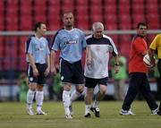 3 August 2005; Dave Rogers, Shelbourne, is escorted  from the pitch by Eamonn Collins after receiving a red card. UEFA Champions League, Second Qualifying Round, Second Leg, FC Steuea Bucharest v Shelbourne FC , Ghencea Stadium, Bucharest, Romania. Picture credit; Brian Lawless / SPORTSFILE