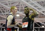 26 February 2014; Tabarie Henry, right, alongside David Mccarthy, after winning the men's 400m event during the AIT International Arena Grand Prix. Athlone Institute of Technology International Arena, Athlone, Co. Westmeath. Picture credit: Stephen McCarthy / SPORTSFILE