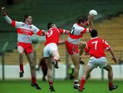 11 April 1999; Anthony Tohill of Derry wins a kickout ahead of team-mate Enda Muldoon and Liam Honohan and Martin Cronin of Cork during the Church and General National Football League Quarter-Final match between Cork and Derry at Croke Park in Dublin. Photo by Ray McManus/Sportsfile