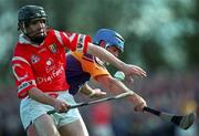 18 April 1999; Ben O'Connor of Cork in action against Eugene Furlong of Wexford during the Church & General National Hurling League Division 1B match between Wexford and Cork at Páirc Uí Shíocháin in Gorey, Wexford. Photo by Ray McManus/Sportsfile