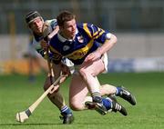 18 April 1999; Billy O'Sullivan of Waterford in action against Conor Gleeson of Tipperary during the Church and General National Hurling League Division 1B match between Tipperary and Waterford at Semple Stadium in Thurles, Tipperary. Photo by Brendan Moran/Sportsfile