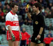 11 April 1999; Joe Brolly of Derry is shown a yellow card by referee Brian White during the Church and General National Football League Quarter-Final match between Cork and Derry at Croke Park in Dublin. Photo by Ray McManus/Sportsfile