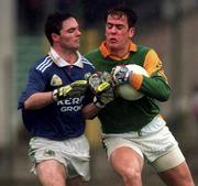 11 April 1999; Cormac Sullivan of Meath is tackled by Gerard Murphy of Kerry during the Church & General National Football League Division 1 Quarter-Final match between Kerry and Meath at the Gaelic Grounds in Limerick. Photo by Brendan Moran/Sportsfile