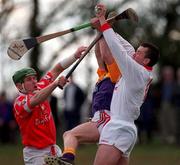 18 April 1999; Cork goalkeeper Donal Og Cusack takes the ball ahead of team-mate Pat Ryan and Chris McGrath of Wexford during the Church & General National Hurling League Division 1B match between Wexford and Cork at Páirc Uí Shíocháin in Gorey, Wexford. Photo by Ray McManus/Sportsfile