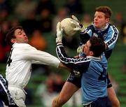 11 April 1999; Dublin goalkeeper David Byrne and team-mate Paddy Christie in action against Karl O'Dwyer of Kildare during the Church and General National Football League Quarter-Final match between Dublin and Kildare at Croke Park in Dublin. Photo by Ray McManus/Sportsfile