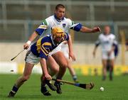 18 April 1999; Eamon Corcoran of Tipperary in action against Dan Shanahan of Waterford during the Church and General National Hurling League Division 1B match between Tipperary and Waterford at Semple Stadium in Thurles, Tipperary. Photo by Brendan Moran/Sportsfile