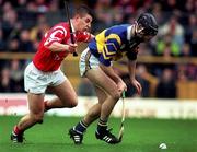 4 April 1999; Eddie Tucker of Tipperary in action against Derek Barrett of Cork during the Church & General National Hurling League Division 1B match between Tipperary and Cork at Semple Stadium in Thurles, Tipperary. Photo by Brendan Moran/Sportsfile