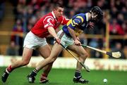 4 April 1999; Eddie Tucker of Tipperary in action against Derek Barrett of Cork during the Church & General National Hurling League Division 1B match between Tipperary and Cork at Semple Stadium in Thurles, Tipperary. Photo by Brendan Moran/Sportsfile