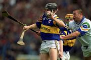 18 April 1999; Fergal Heaney of Tipperary in action against Peter Queally of Waterford during the Church and General National Hurling League Division 1B match between Tipperary and Waterford at Semple Stadium in Thurles, Tipperary. Photo by Brendan Moran/Sportsfile