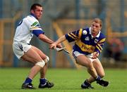 18 April 1999; Ger Maguire of Tipperary in action against Peter Queally of Waterford during the Church and General National Hurling League Division 1B match between Tipperary and Waterford at Semple Stadium in Thurles, Tipperary. Photo by Brendan Moran/Sportsfile