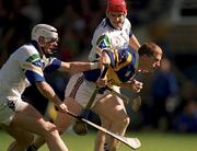 18 April 1999; Ger Maguire of Tipperary is tackled by Stephen Frampton, left, and Peter Queally of Waterford during the Church and General National Hurling League Division 1B match between Tipperary and Waterford at Semple Stadium in Thurles, Tipperary. Photo by Brendan Moran/Sportsfile