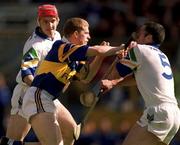 18 April 1999; Ger Maguire of Tipperary is tackled by Stephen Frampton, left, and Peter Queally of Waterford during the Church and General National Hurling League Division 1B match between Tipperary and Waterford at Semple Stadium in Thurles, Tipperary. Photo by Brendan Moran/Sportsfile