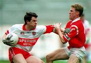 11 April 1999; Joe Brolly of Derry in action against Anthony Lynch of Cork during the Church and General National Football League Quarter-Final match between Cork and Derry at Croke Park in Dublin. Photo by Ray McManus/Sportsfile