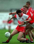 11 April 1999; Joe Brolly of Derry in action against Anthony Lynch and Padraig O'Mahony of Cork during the Church and General National Football League Quarter-Final match between Cork and Derry at Croke Park in Dublin. Photo by Ray McManus/Sportsfile