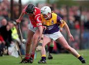 18 April 1999; John Browne of Cork in action against Tom Dempsey of Wexford during the Church & General National Hurling League Division 1B match between Wexford and Cork at Páirc Uí Shíocháin in Gorey, Wexford. Photo by Ray McManus/Sportsfile