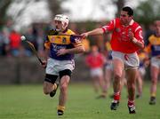 18 April 1999; Martin Storey of Wexford in action against Sean Og O hAilpin of Cork during the Church & General National Hurling League Division 1B match between Wexford and Cork at Páirc Uí Shíocháin in Gorey, Wexford. Photo by Ray McManus/Sportsfile