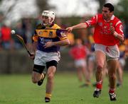 18 April 1999; Martin Storey of Wexford in action against Sean Og O hAilpin of Cork during the Church & General National Hurling League Division 1B match between Wexford and Cork at Páirc Uí Shíocháin in Gorey, Wexford. Photo by Ray McManus/Sportsfile